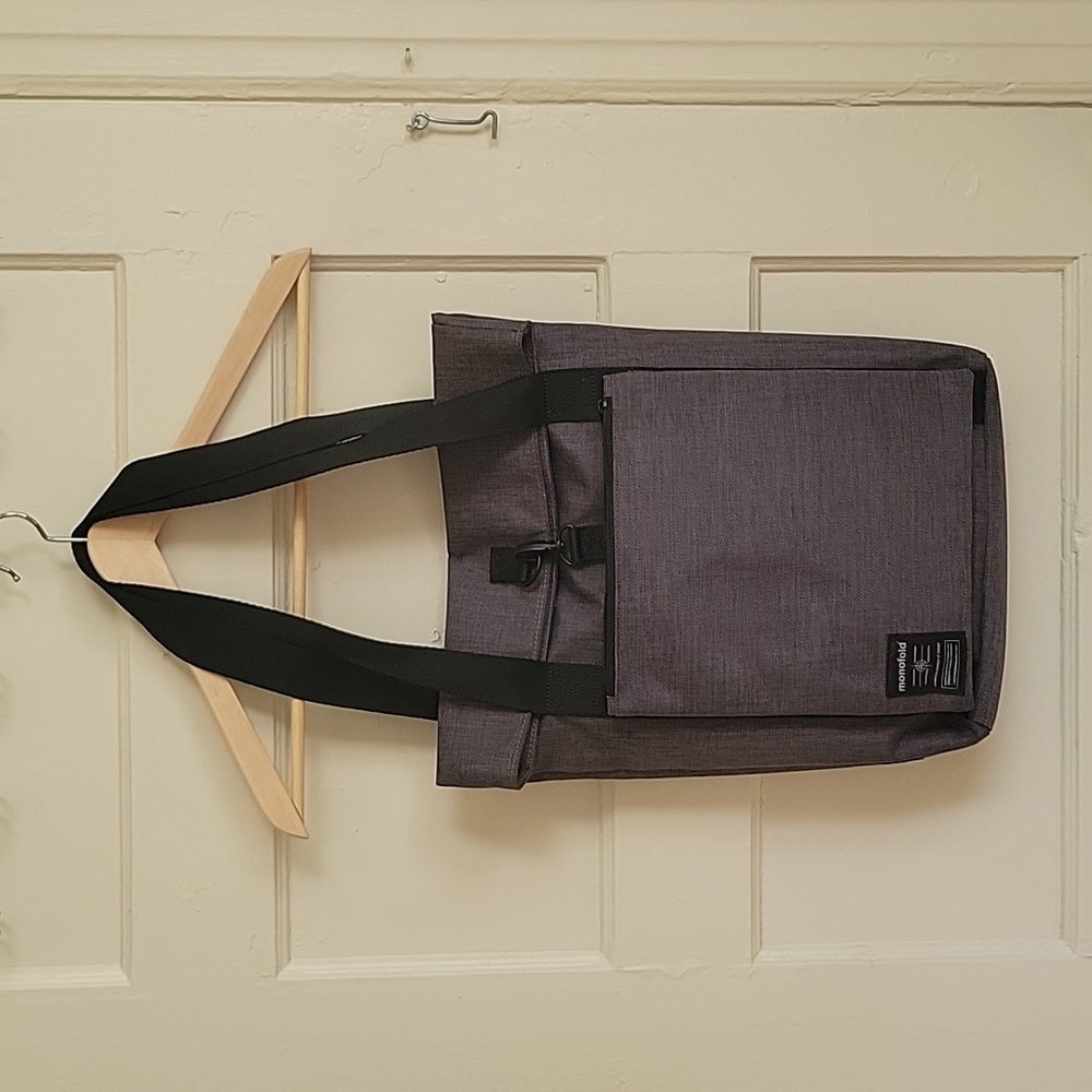 Monofold black and grey tech bag.